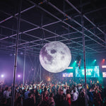 Trippy Creations giant LED inflatable moon decoration, realistic surface detail, perfect for parties and events.