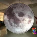 Trippy Creations giant inflatable moon decoration, realistic lunar surface detail, illuminated for events and parties.