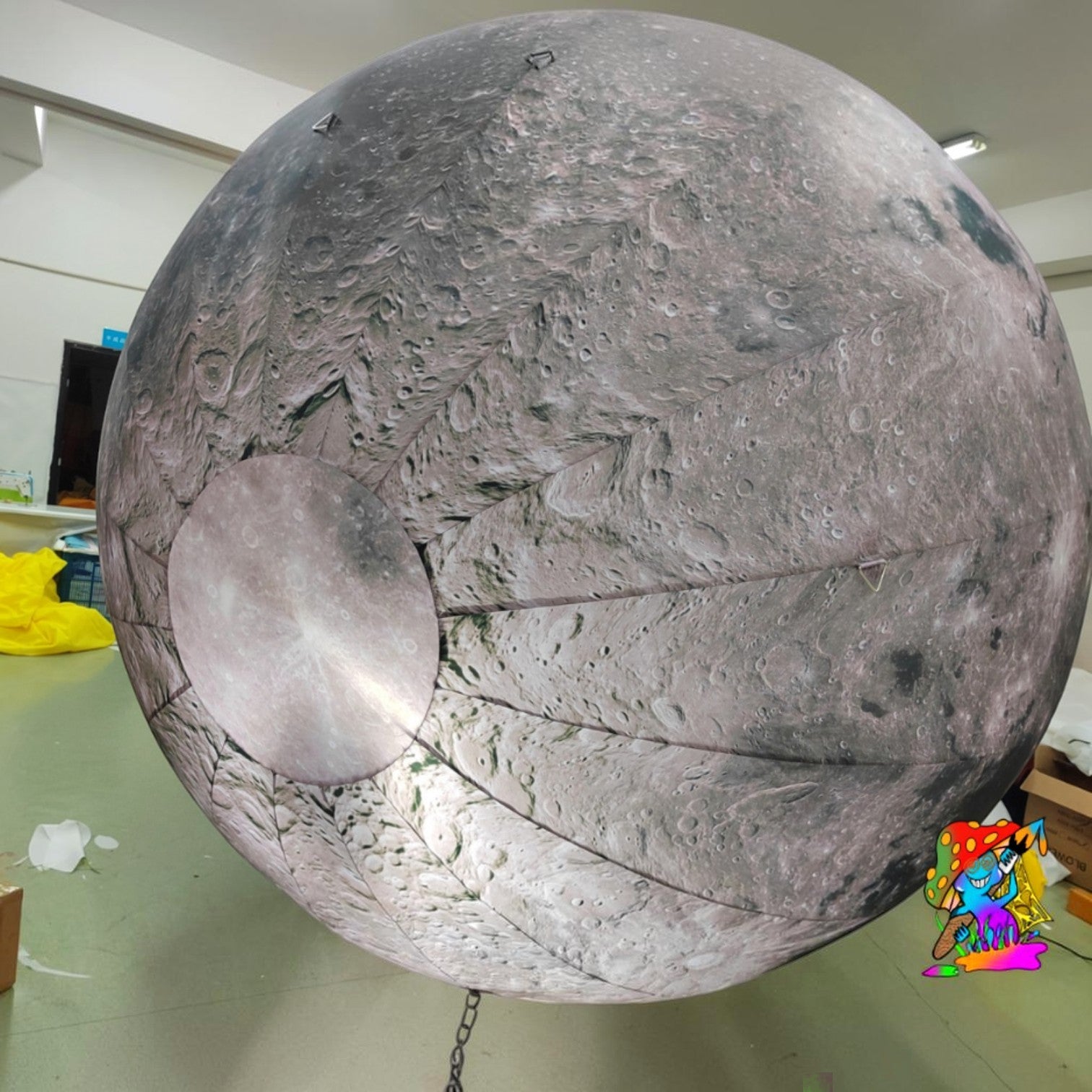 Trippy Creations giant inflatable moon decoration with realistic crater details and LED lighting. Perfect for events.