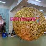Trippy Creations giant inflatable Jupiter planet, yellow and brown speckled, for space-themed events and hanging installations.