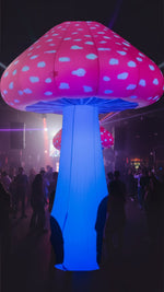 Trippy Creations 3m inflatable mushroom prop with pink cap and blue flashing LED stem, ideal for parties.