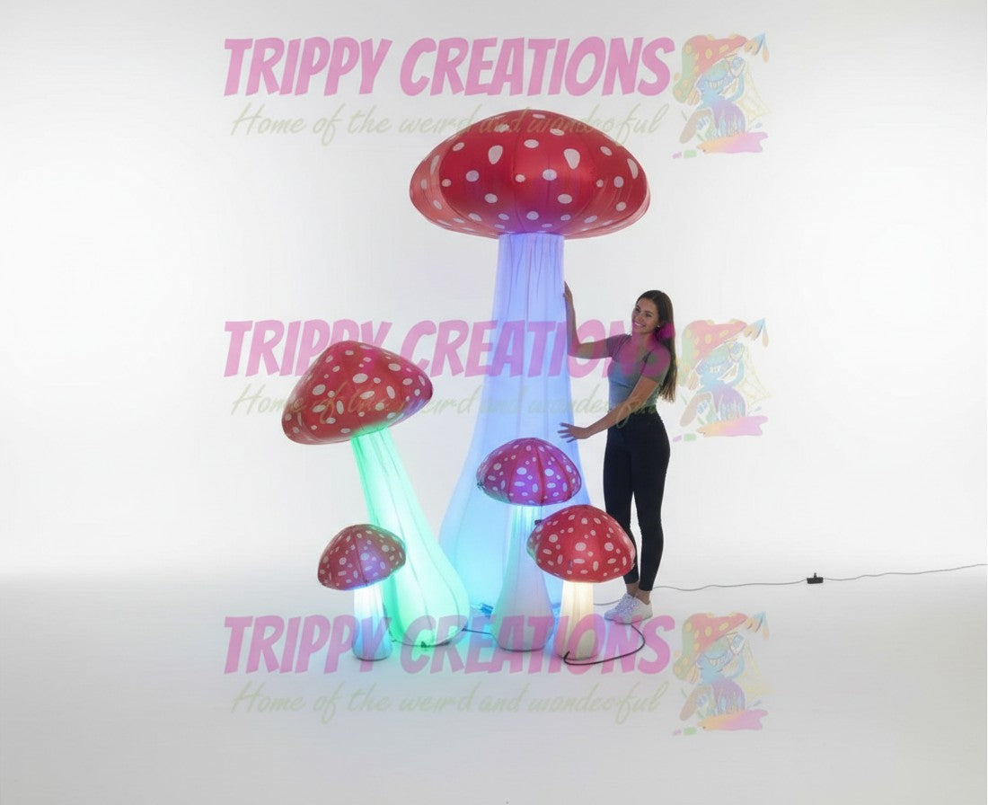 Trippy Creations set of 5 red and white inflatable mushrooms with LED lights, varying sizes, perfect for parties and festivals.