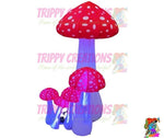 Trippy Creations set of 5 mini LED inflatable mushrooms, red with white spots, Alice in Wonderland party decor.