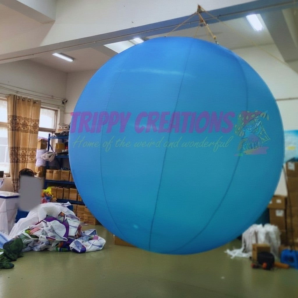 Trippy Creations large blue inflatable planet, perfect for space-themed events and hanging installations.