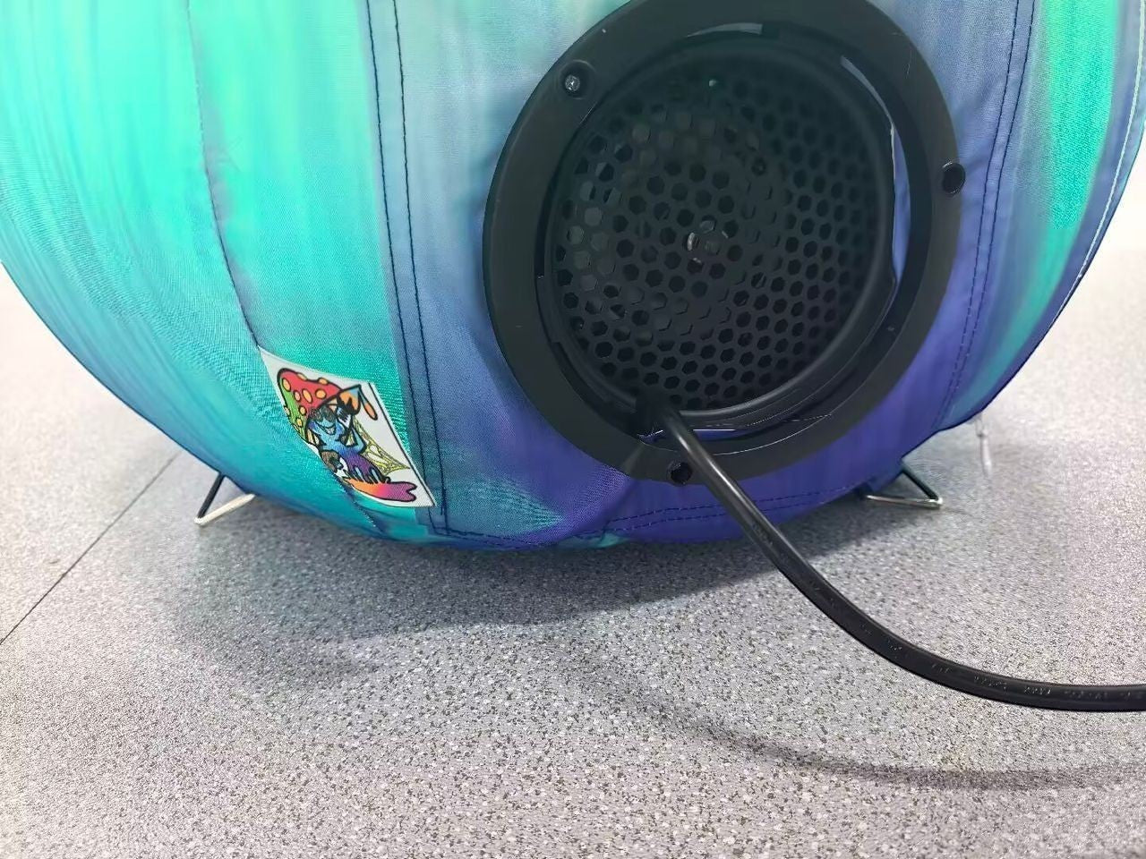 Trippy Creations LED inflatable mushroom prop with teal and purple iridescent fabric and a black fan housing.