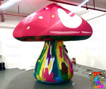 Trippy Creations giant pink fairy mushroom inflatable with white spots on cap and colorful psychedelic stem. Oxford fabric.