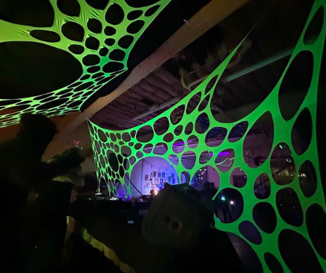 Stretchy UV-reactive webs for wall decor. trippy neon green room decor

