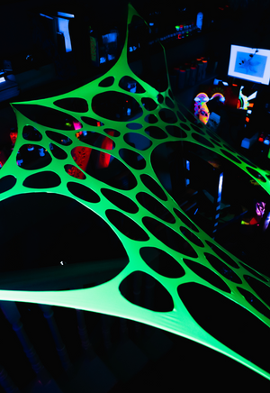 UV Reactive green polka dot event decorations.