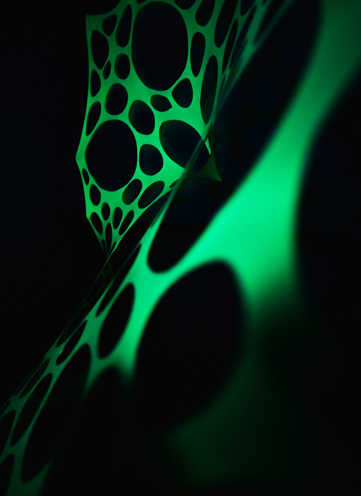 UV Reactive green polka dot event decorations.