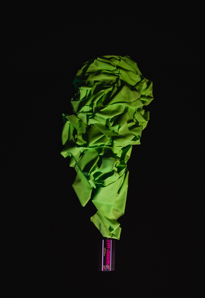 UV Reactive green polka dot event decorations.