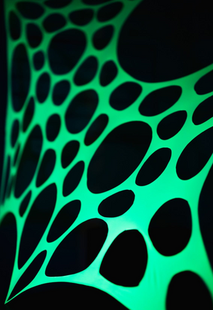 UV Reactive green polka dot event decorations.