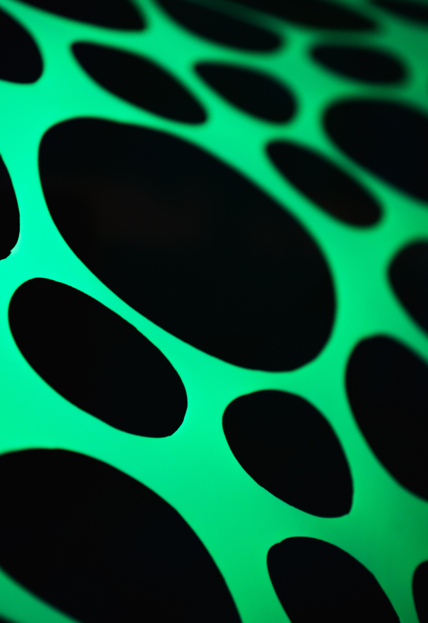 UV Reactive green polka dot event decorations.