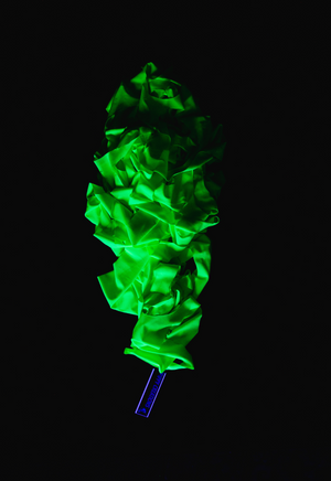 UV Reactive green polka dot event decorations.
